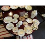 A quantity of mostly Limoge tea cups and saucers, jugs,