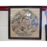 An embroidered silk depicting exotic birds, framed and glazed,