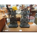 A pair of reproduction cast metal umbrella stands in the Victorian style