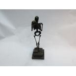 A bronze skeleton holding a skull, signed Carl Kayba on marble plinth,