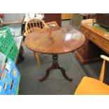 A 19th Century mahogany circular tilt-top wine table