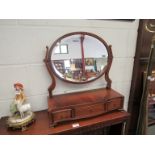 A lady's toilet mirror with three jewellery drawer base