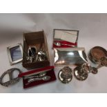 Mixed silver including a cigarette box, dwarf candlesticks, picture frames etc,