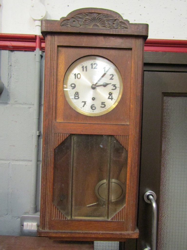 An oak cased wall clock, 1940's,