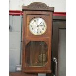 An oak cased wall clock, 1940's,