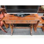 A lyre-ended sofa table