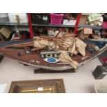 A model painted wood sail boat, mast a/f, on stand,