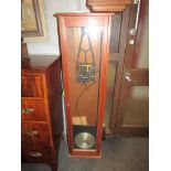 A Synchronome electric slave clock with invar pendulum, a/f, teak case.