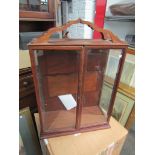 WITHDRAWN - A mahogany display case with assorted miniature items