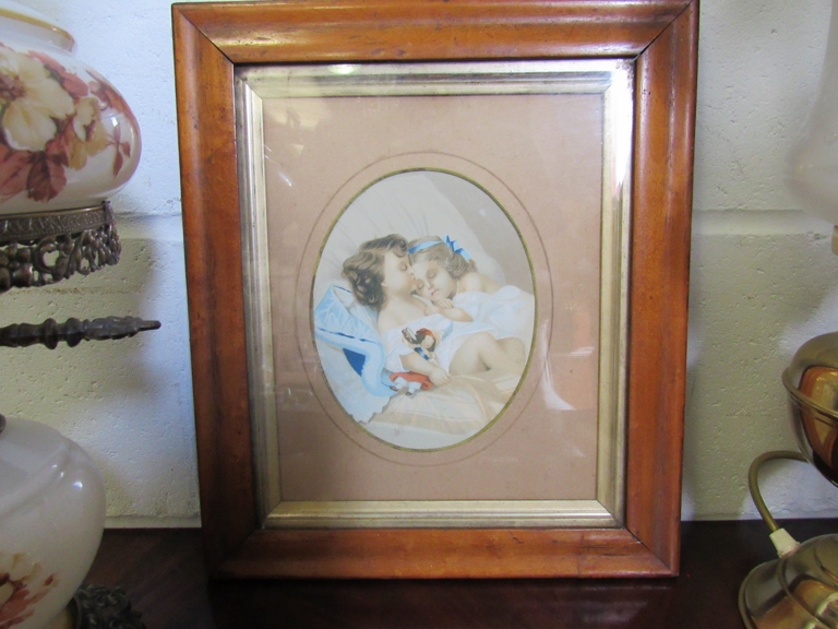 A Victorian maple framed print of two sleeping girls,