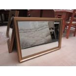 A modern bevelled edge rectangular mirror,