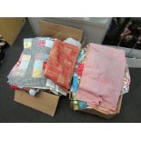 Two boxes of mixed vintage fabric remnants