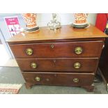 A George III mahogany chest of three straight drawers, brass plate handles,