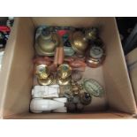 A mixed lot including brass candlesticks, duck form book ends, various brassware and oil lamps,