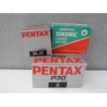 A Pentax P30 SLR camera,