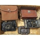 Four various vintage cameras including Coronet "Vogue" Bakelite Deco camera and Vest pocket Kodak