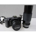 An Olympus OM101 Power Focus SLR camera with accessories