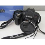 A Canon Powershot SX50 HS bridge digital camera,