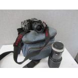 A Canon A1 SLR camera with lenses,