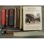A collection of photography reference books including "Britain Then & Now" and "1000 Photo Icons"