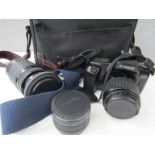 A Canon EOS 1000F SLR camera with 35-80mm and 75-300mm lenses and accessories,