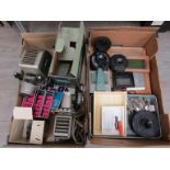 A collection of photographic darkroom equipment including enlarger,