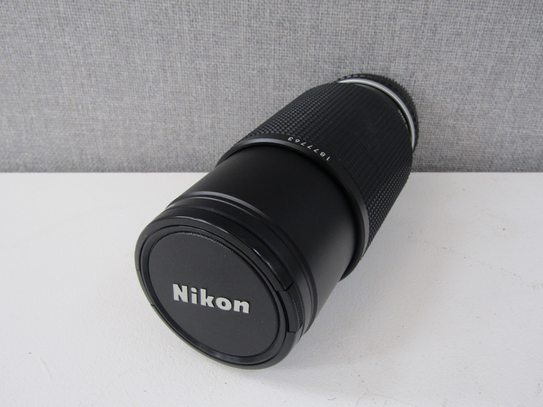 A Nikon 70-210mm series E zoom lens, serial no.