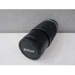 A Nikon 70-210mm series E zoom lens, serial no.