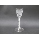 An 18th Century wine glass with round funnel shaped bowl engraved with fruiting vines and a
