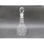 A Georgian Irish glass triple ring neck decanter with thumb moulded tear drop shaped stopper,