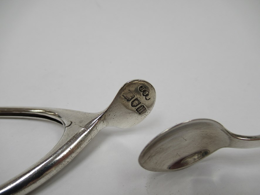 Two pairs of silver sugar tongs including Georgian bright-cut design together with a stirrup - Image 3 of 4