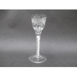 A mid 18th Century wine glass, the ogee bowl engraved with stylised flowers,