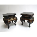 A pair of lacquered stands for vases