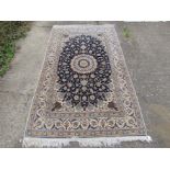 A modern hand made carpet with retail label "Oriental Carpet Bazaar Riyadh" Saudi Arabia,