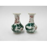 A pair of miniature 19th Century Oriental vases decorated with dragons, 7.