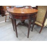 A Georgian mahogany demi-lune fold top tea table with square tapering, satinwood inlay to edge,