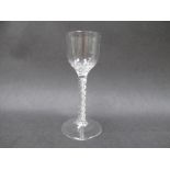 A mid 18th Century wine glass with honeycomb and wrythen fluted moulding to the base of the ogee