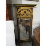 A gilded and ebonised tall pier mirror with lion mask and swag detail. 153cm high.