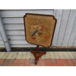 A 19th Century rosewood polescreen with tapestry panel, 82.