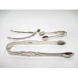 Two pairs of silver sugar tongs including Georgian bright-cut design together with a stirrup