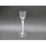 A mid 18th Century cordial glass with small ogee bowl raised upon a double formation air twist stem