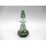 A Victorian cut green overlay clear glass scent bottle of panelled conical form with cushioned base