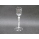 A mid 18th Century wine glass with flute moulded ogee bowl on an opaque double twist stem and