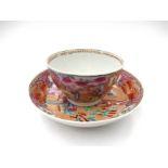 A Newhall polychrome tea bowl and saucer