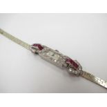 An Art Deco white gold cocktail watch with rubies and diamonds, with later 9ct gold strap,