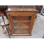 A Victorian walnut pier cabinet with ormolu and parquetry embellishment, silk lined interior,