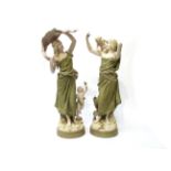 A pair of Royal Dux figures young maiden with child on her shoulder and another with child beside