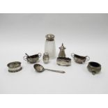 A collection of silver items including cruet pots,