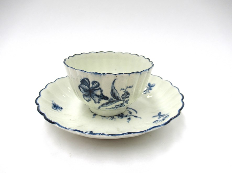 A First Period Worcester blue and white "Cornflower" pattern tea bowl and saucer