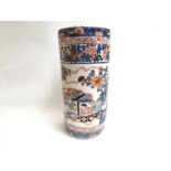 A Chinese umbrella stand with character marks to base,